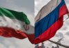 Flagi Iranu i Rosji.
